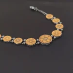 antique dual tone coin link bracelet