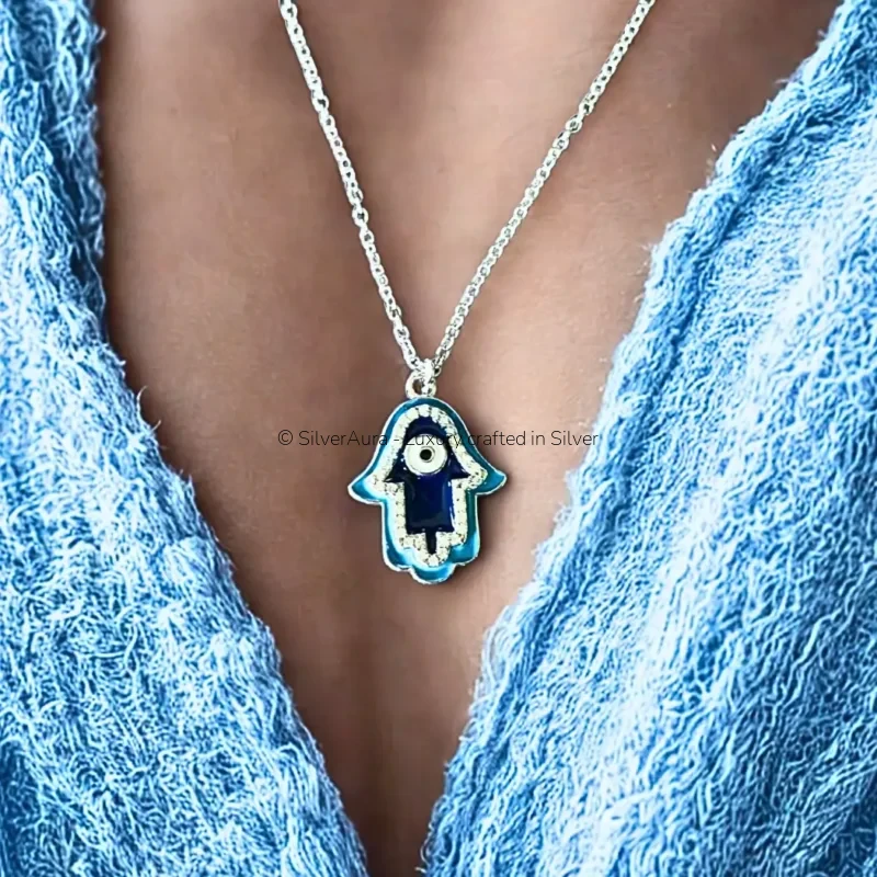 Hamsa evil eye pendant, close-up view