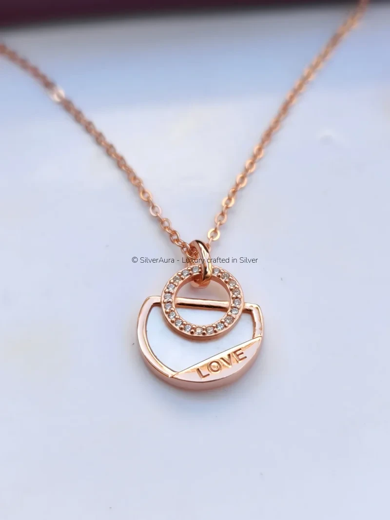 Love charm pendant with rose gold polish and zircon sparkle