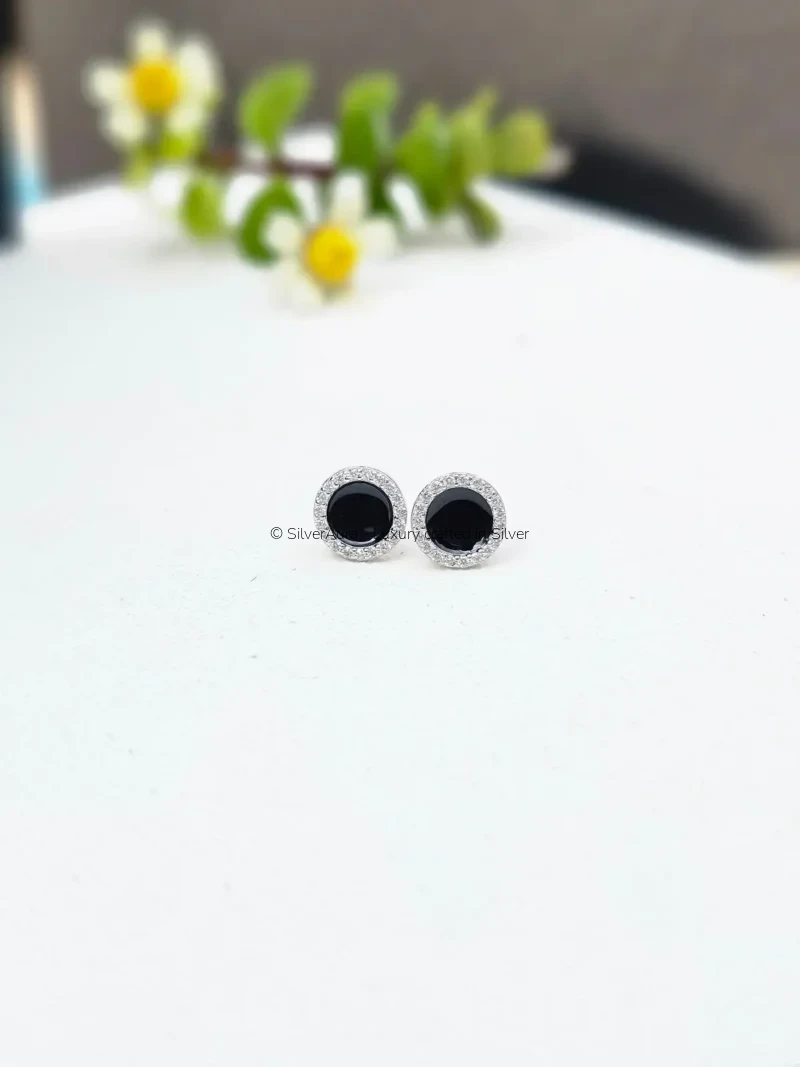 Fan stud earrings with black enamel and pave stones