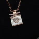 Gift box pendant with rose gold polish and heart studs