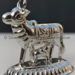 Kamdhenu Mata silver idol with calf, close-up detail