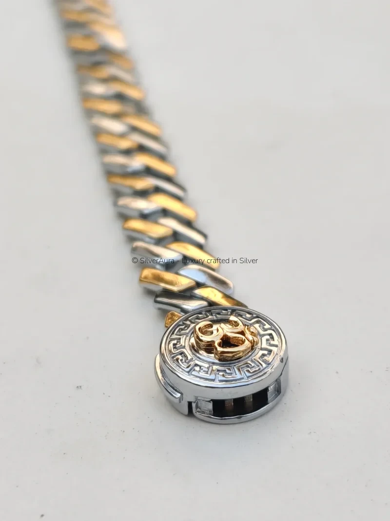 Om silver bracelet worn on wrist