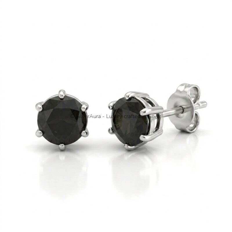 Black solitaire silver studs, close-up view