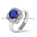 Blue solitaire silver ring worn on hand