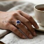 Blue solitaire silver ring, close-up view