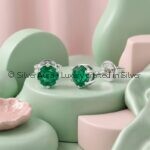 Green solitaire silver earrings, close-up view